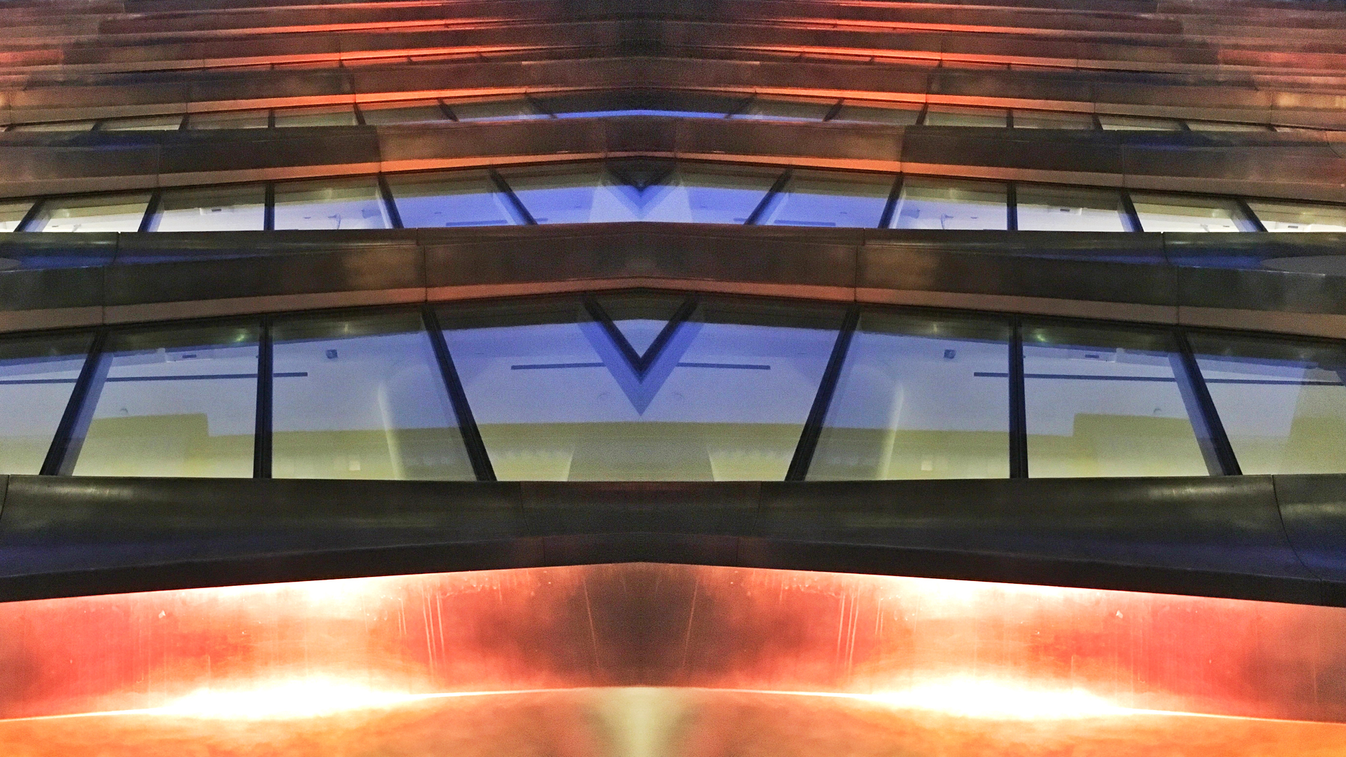 Zaha Hadid in West Chelsea night time with dramatic lighting of the building